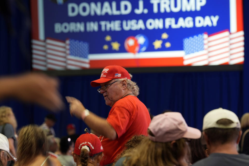 Supporters arrive before Republican presidential candidate former President Donald Trump speaks at his birthday celebration, hosted by Club 47, in West Palm Beach, Fla., Friday, June 14, 2024. (AP Photo/Gerald Herbert)