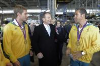 Federal Opposition Leader Tony Abbott speaks to gold medal London 2012 Olympic athletes After arriving at Sydney Airport Wednesday August 15, 2012 . (AAP Image/Mick Tsikas) NO ARCHIVING