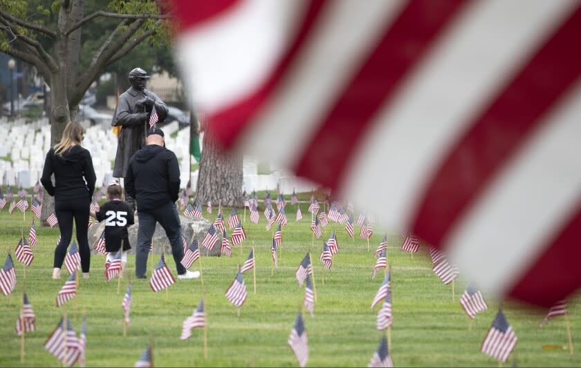 LOS ANGELES, CA - MAY 29: Flags were planted at Los Angeles National Cemetery on Saturday, May 29, 2021 in remembrance of Memorial Day. (Myung J. Chun / Los Angeles Times)
