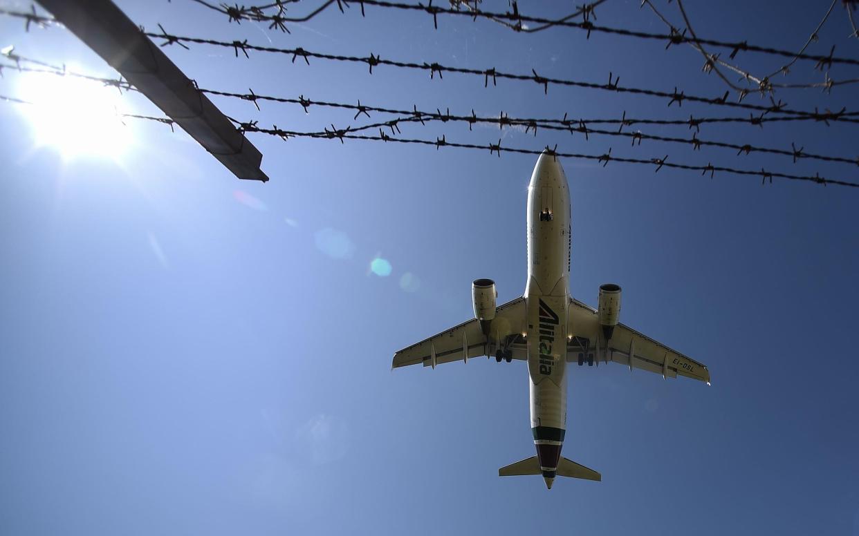 Flights have continued to arrive into the UK - AFP