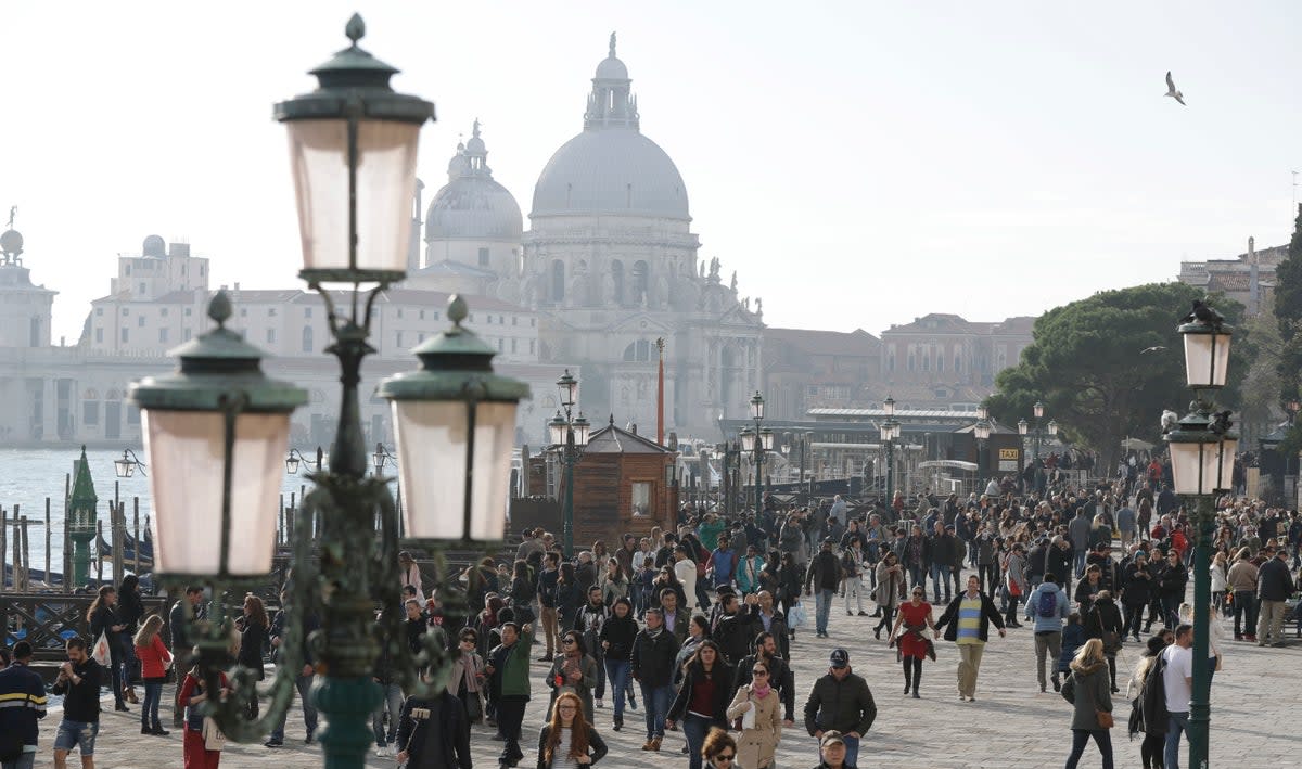 Venice will oblige day-trippers to make reservations and pay a fee come January (AP)