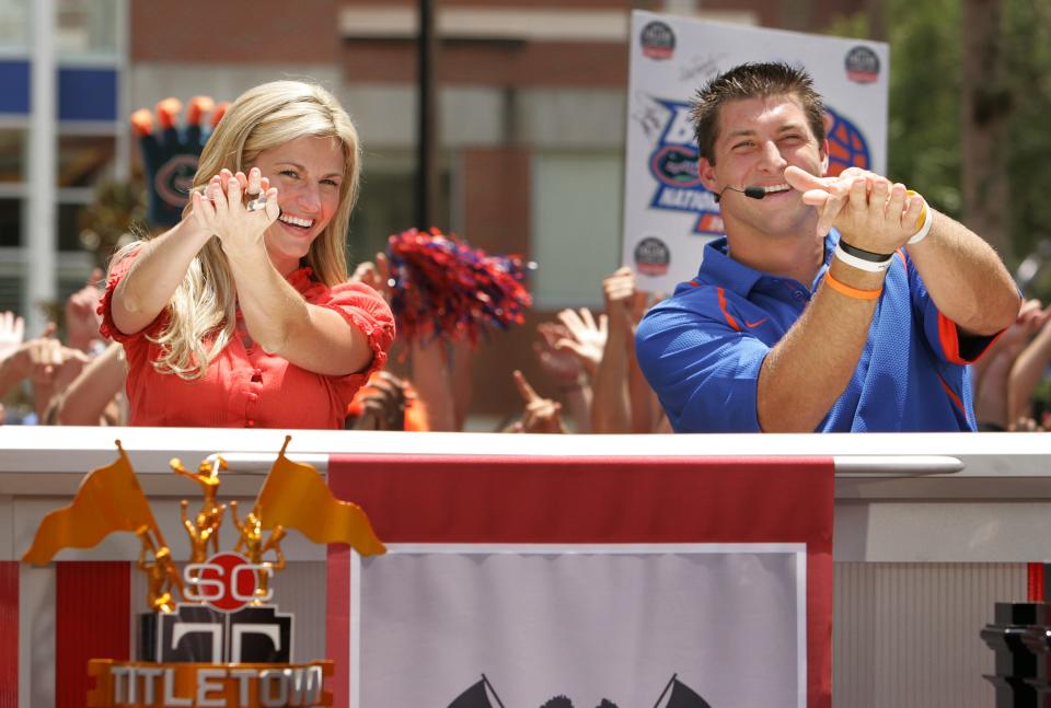 ESPN's Erin Andrews and Florida quarterback Tim Tebow do the Gator Chomp together during the taping of ESPN's TitleTown U.S.A. in front of Ben Hill Griffin Stadium on the UF campus Thursday, July 10, 2008.
