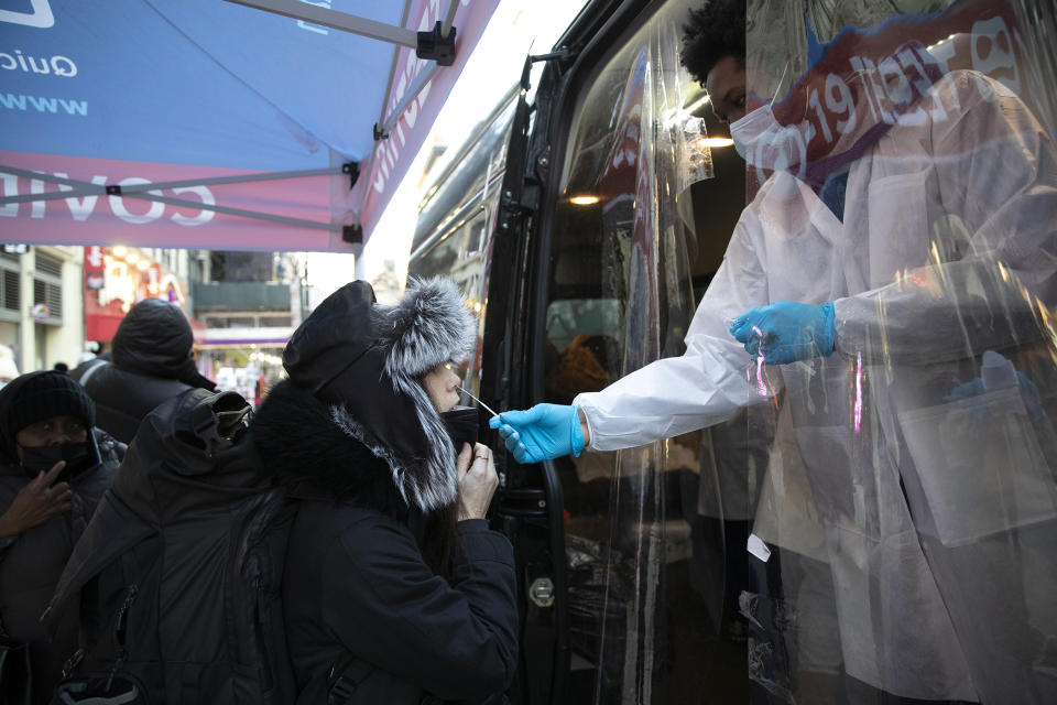 Image: A woman gets tested at a mobile Covid-19 testing van on 14th Street, in N.Y. (Liao Pan / China News Service via Getty Images)