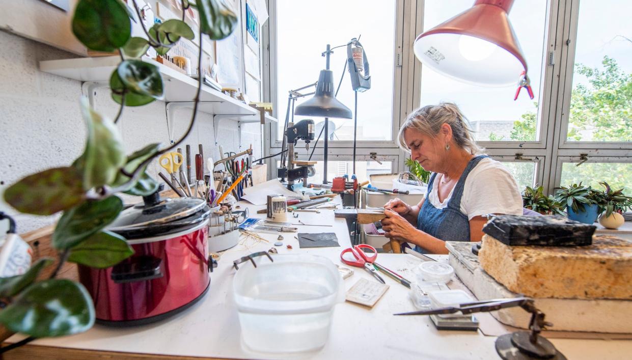 Nicole Jacquard works on jewelry inside her studio at the Eskenazi School of Art, Architecture + Design at Indiana University on Wednesday, July 12, 2023.