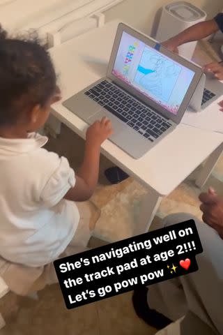 <p>Brittany Bell/Instagram</p> Powerful Cannon using a laptop at age 2