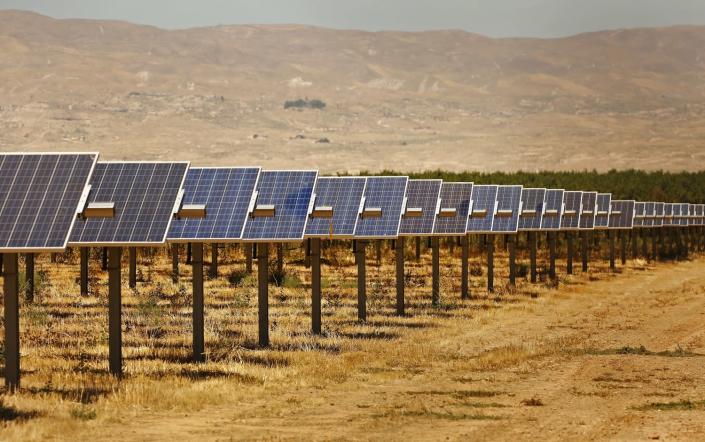 The 20-megawatt Maricopa West solar project, surrounded by almond groves, was built on Kern County farmland.