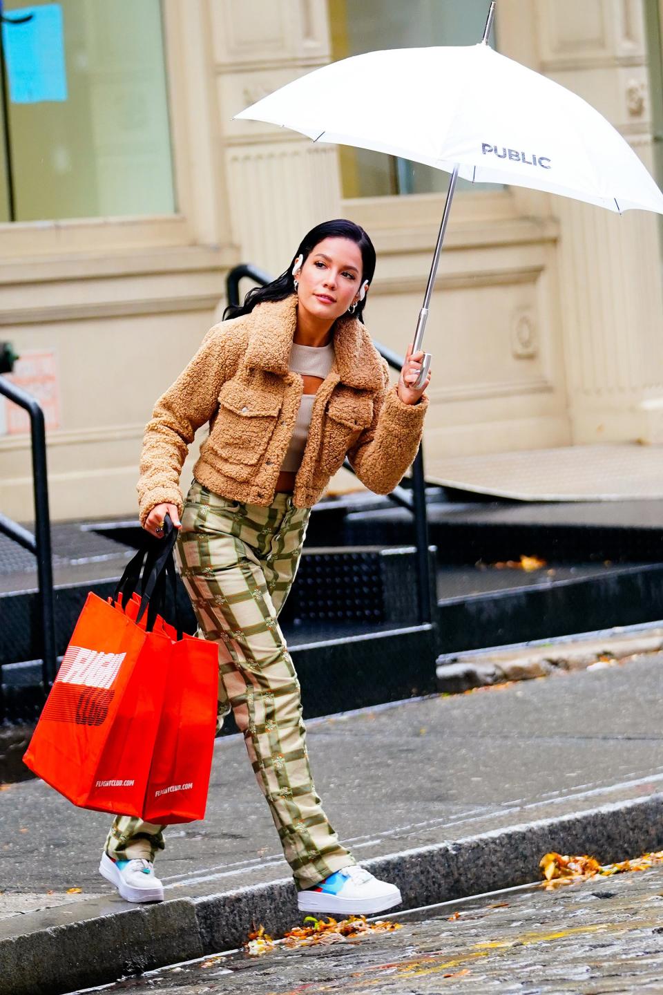 Halsey walks around N.Y.C.’s SoHo neighborhood in the rain while filming a music video on Wednesday.