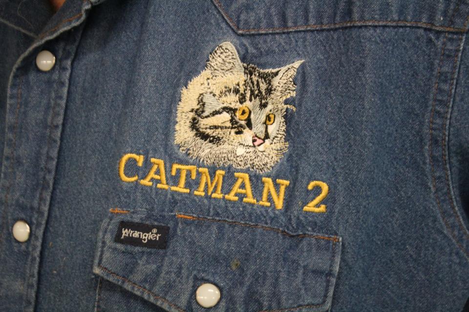 Harold Sims (aka Catman) often wears a jean shirt that has 