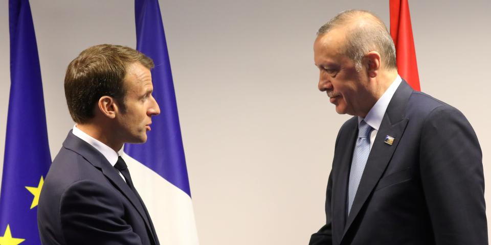 FILE PHOTO: French President Emmanuel Macron (L) shakes hands with Turkish President Recep Tayyip Erdogan before a bilateral meeting on the sidelines of a North Atlantic Treaty Organization (NATO) summit in Brussels, Belgium July 12, 2018.  Ludovic Marin/Pool via REUTERS/File Photo