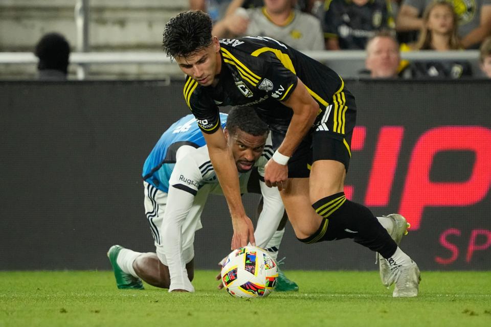 Crew forward Max Arfsten, right, collides with Charlotte FC defender Nathan Byrne during the second half of Wednesday's 1-1 draw.