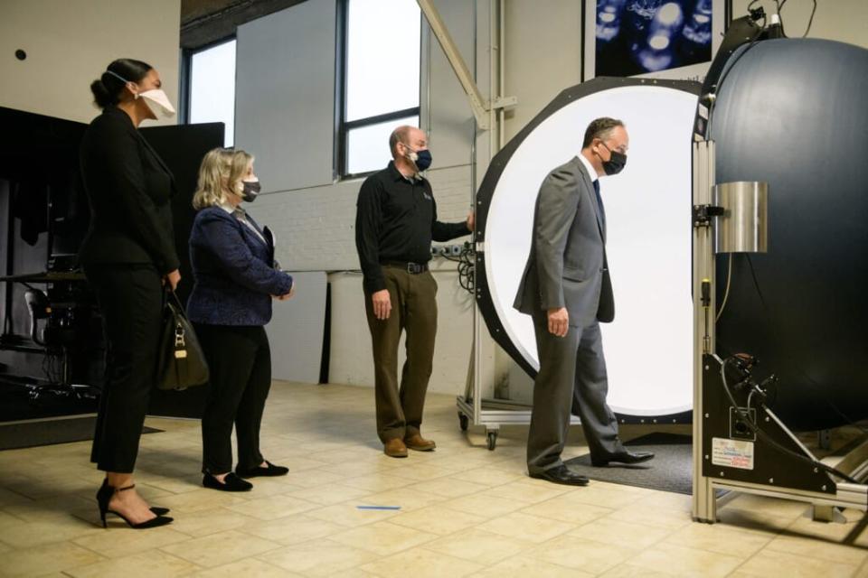 Second Gentleman Doug Emhoff (R) stands with Small Business Administration assistant administrator Natalie Madeira Cofield (L), and Pennsylvania Representative Susan Wild (C) as they listen to Mike Grather (2nd R), president of Lightlab international demonstrate equipment during a tour of the Bridgeworks Enterprise Center, a small business incubator, in Allentown, Pennsylvania on May 5 ,2021. (Photo by Ed JONES / POOL / AFP) (Photo by ED JONES/POOL/AFP via Getty Images)