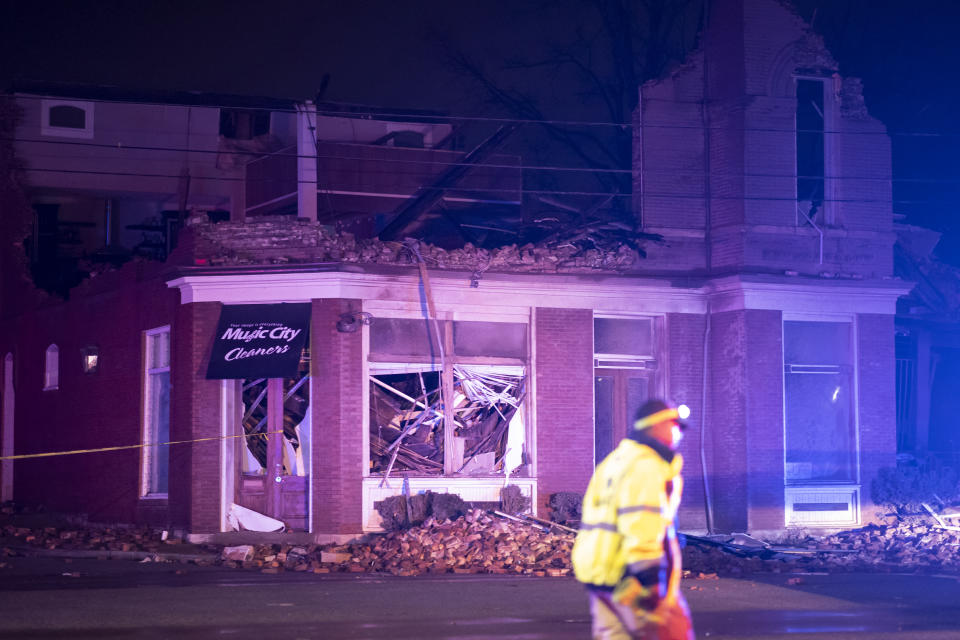 Emergency crews work near a damaged business at Jefferson St. and Seventh Ave. N. on March 3, 2020 in Nashville, Tennessee. A tornado passed through Nashville just after midnight leaving a wake of damage in its path. (Brett Carlsen/Getty Images)