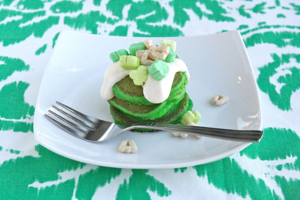 <p>Drizzled with a rich and sweet cream cheese topping (complete with green Lucky Charms), this hearty breakfast is the perfect way to kickstart a day of festivities.</p><p><strong><a href="https://www.countryliving.com/food-drinks/recipes/a30186/green-velvet-silver-dollar-pancakes-recipe-ghk0314/" rel="nofollow noopener" target="_blank" data-ylk="slk:Get the recipe;elm:context_link;itc:0;sec:content-canvas" class="link ">Get the recipe</a>.</strong> </p>