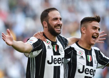 Football Soccer - Juventus v Sassuolo - Italian Serie A - Juventus stadium, Turin, Italy - 10/09/16 Juventus' Gonzalo Higuain (L) celebrates with teamate Paulo Dybala after scoring against Sassuolo. REUTERS/Giorgio Perottino.