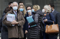 EU Chief Negotiator Michel Barnier, left, with members of his team as he walks to a conference centre in Westminster in London, Sunday, Nov. 29, 2020. Teams from Britain and the European Union are continuing face-to-face talks on a post-Brexit trade deal in the little remaining time. (AP Photo/Kirsty Wigglesworth)