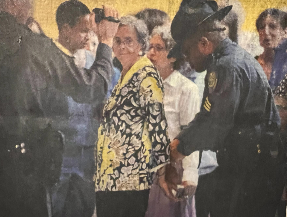 Musette Steck being handcuffed while at a Moral Monday protest in Raleigh in 2013. She was charged with civil disobedience.