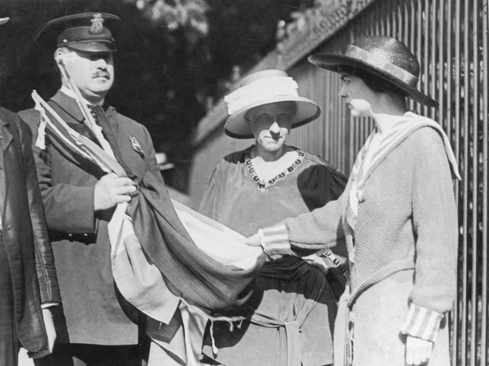 Suffrage banner bearers being arrested during protests outside the White House.