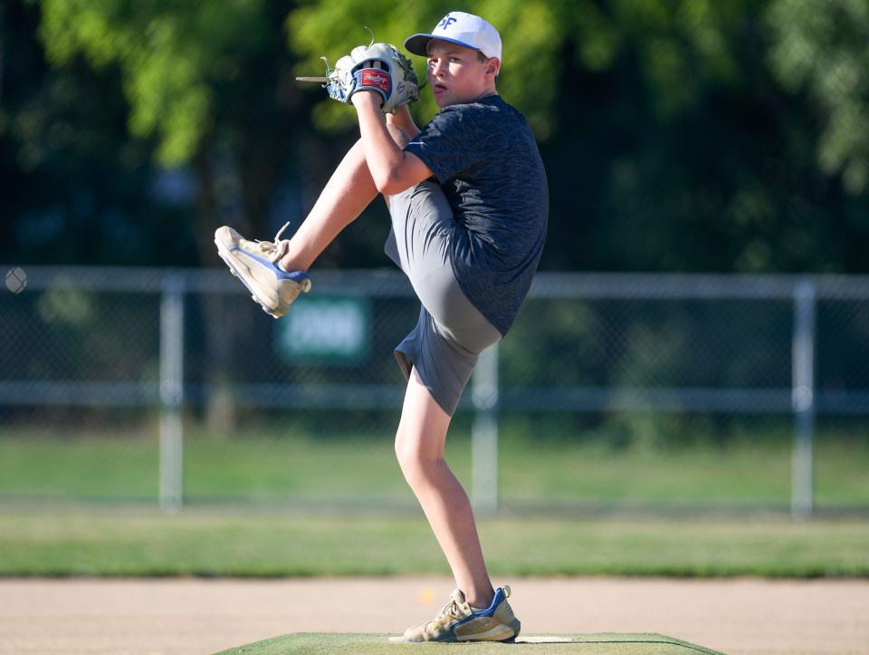 Eli Hart (#10) winds up to pitch during Little League practice on Monday, August 1, 2022, at Cherry Rock Park in Sioux Falls.