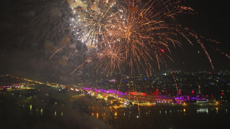 Fireworks light the sky as lamps are light up the banks of the river Saryu on the eve of the Hindu festival of Diwali, in Ayodhya, India, Saturday, Nov. 11, 2023.