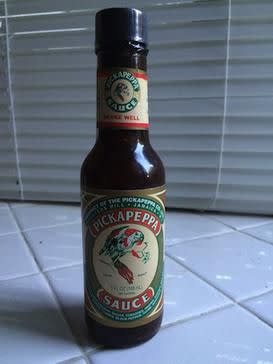 Pickapeppa Sauce bottle, with trademark bird and hot pepper logo