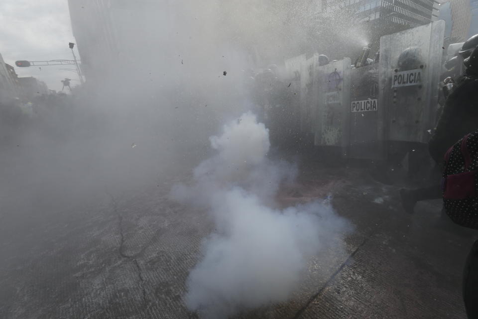 Demonstrators clash with riot police during a march supporting abortion rights in Mexico City, Monday, Sept. 28, 2020. (AP Photo/Marco Ugarte)