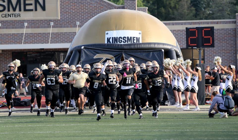 The football team takes the field during the Mishawaka vs. Penn football game Friday, Aug. 25, 2023, at Freed Field. The Kingsmen won over the Cavemen, 28-7.