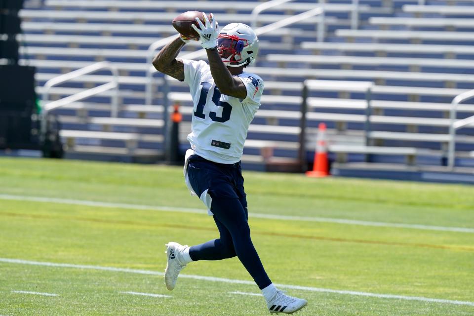 New England Patriots wide receiver N'Keal Harry (15) makes a catch during an NFL football practice in Foxborough, Mass., Thursday, May 27, 2021. (AP Photo/Steven Senne)