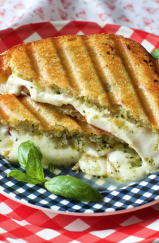 <p>Marla Meredith</p><p>Grilled cheese is the ultimate comfort food. Made with a panini press and smothered with pesto even better!</p><p><strong>Get the recipe: <a href="https://marlameridith.com/recipe/pesto-mozzarella-and-tomato-panini/" rel="nofollow noopener" target="_blank" data-ylk="slk:Pesto Mozzarella and Tomato Panini;elm:context_link;itc:0;sec:content-canvas" class="link rapid-noclick-resp"><em>Pesto Mozzarella and Tomato Panini</em></a></strong></p>