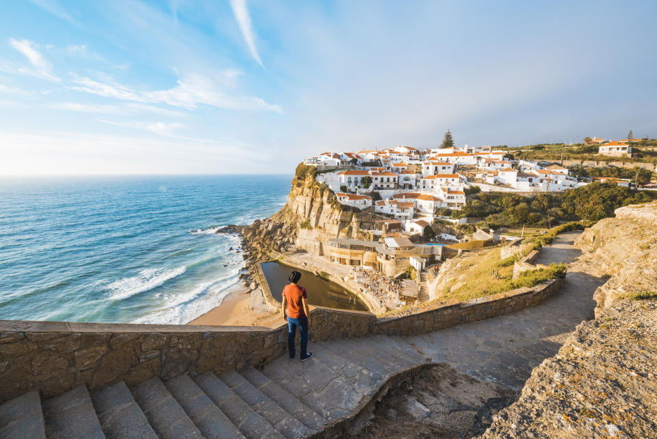 Tourist admiring the view in Azenhas do Mar, Lisbon. (PHOTO: Getty Images)