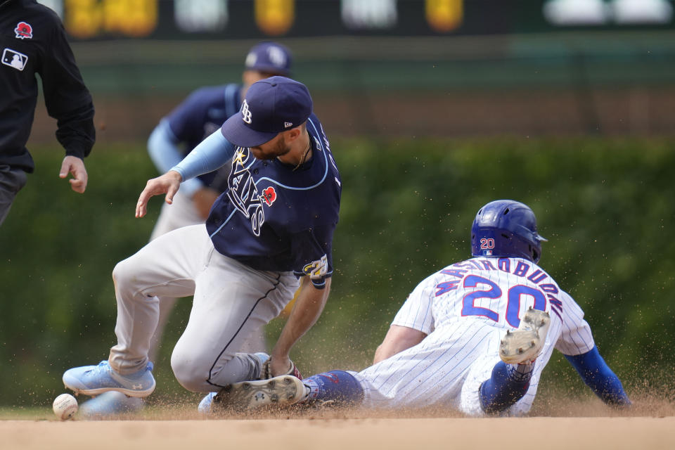 Chicago Cubs' Miles Mastrobuoni, right, steals second against Tampa Bay Rays second baseman Brandon Lowe during the ninth inning of a baseball game Monday, May 29, 2023, in Chicago. (AP Photo/Erin Hooley)