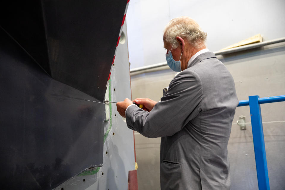 The Prince of Wales attaching the Magpie plaque