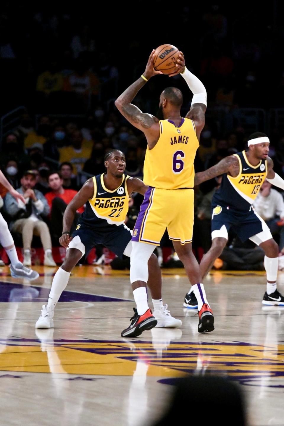 Indiana's Caris LeVert defends Los Angeles' LeBron James as the Lakers host the Pacers at Crypto.com Arena in Los Angeles on Jan. 19, 2022.