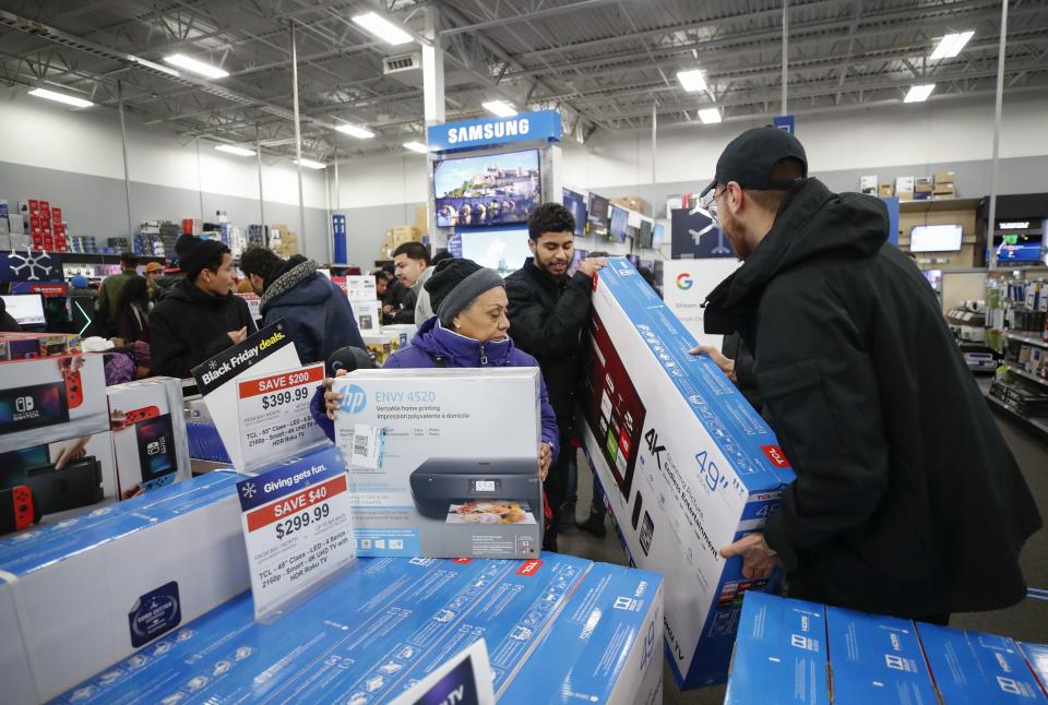 Shoppers pick out flat screen TVs at a Best Buy Inc. store on Nov. 22, 2018 in Chicago.