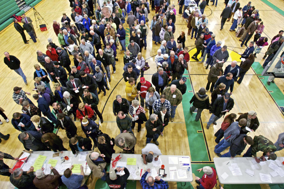 FILE - Registered Republican voters stand in line March 6, 2012, for the caucus event in Rathdrum, Idaho. Idaho Republicans will gather in presidential caucuses this Saturday, March 2, 2024, to help pick their party's presidential standard-bearer. Former president Donald Trump and former United UN Nikki Haley will compete for the state's 32 Republican delegates, as will Texas businessman and pastor Ryan Binkley. (AP Photo/Coeur d'Alene Press, Jerome A. Pollos)