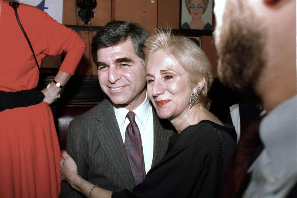 FILE - In this Feb. 23, 1988 file photo, Massachusetts Gov. Michael Dukakis poses with cousin Olympia Dukakis during fundraiser in New York. Olympia Dukakis, the veteran stage and screen actress whose flair for maternal roles helped her win an Oscar as Cher’s mother in the romantic comedy “Moonstruck,” has died. She was 89. (AP Photo/Ray Stubblebine, File)