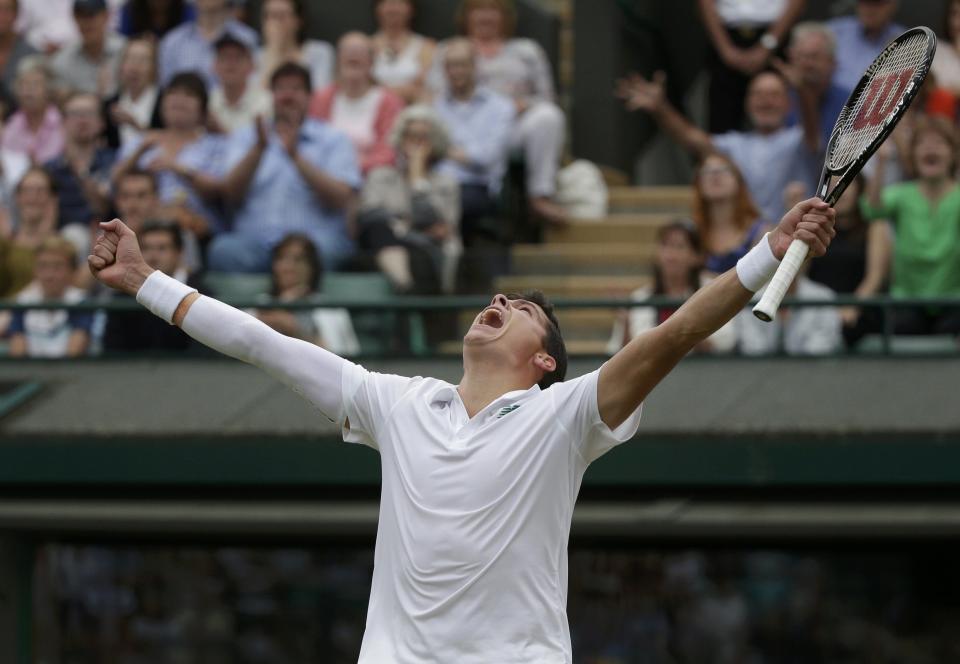 Milos Raonic of Canada reacts after defeating Nick Kyrgios of Australia in their men's singles quarter-final tennis match against at the Wimbledon Tennis Championships, in London July 2, 2014. REUTERS/Max Rossi (BRITAIN - Tags: SPORT TENNIS TPX IMAGES OF THE DAY)