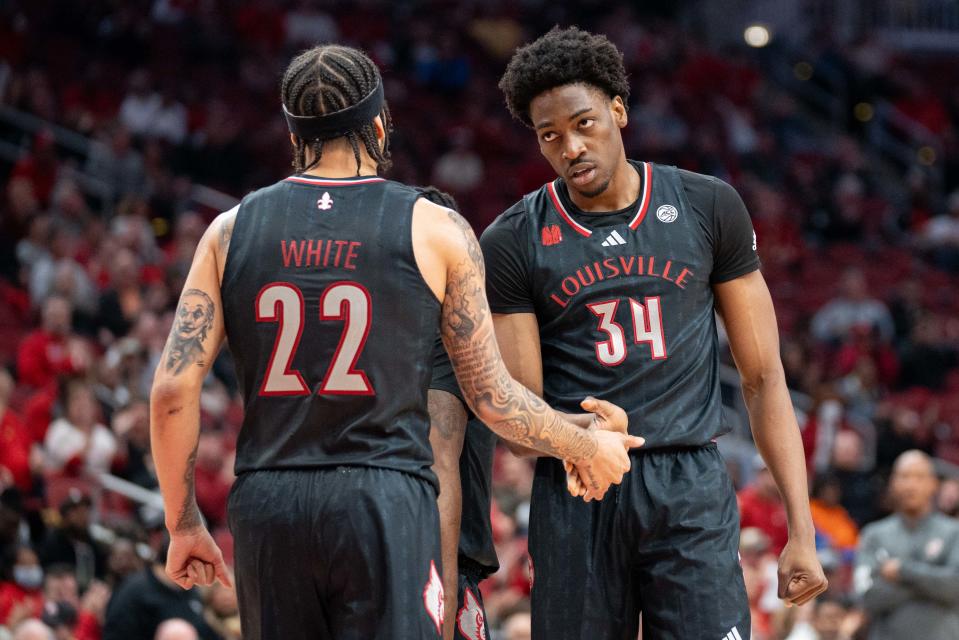 Louisville Cardinals guard Tre White (22) celebrates Emmanuel Okorafor’s (34) foul during their game against the Florida State Seminoles on Saturday, Feb. 3, 2024 at KFC YUM Center.