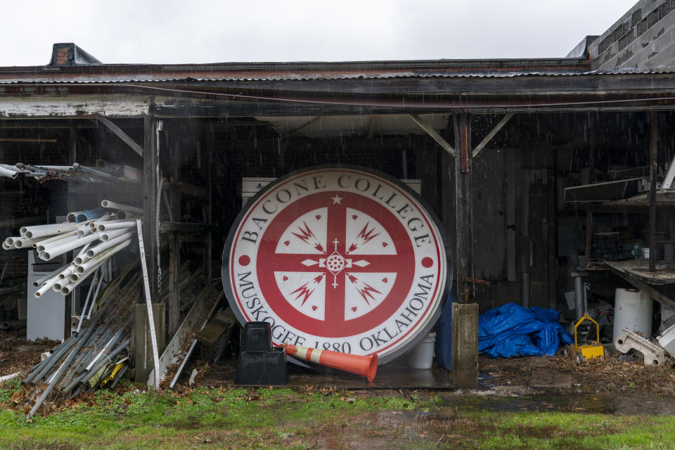 An old sign for the school sits in a storage shed at Bacone College, on Jan. 8 2024, in Muskogee, Okla. Founded in 1880 as a Baptist missionary college focused on assimilation, Bacone College transformed into an Indigenous-led institution that provided an intertribal community, as well as a degree. (AP Photo/Nick Oxford)