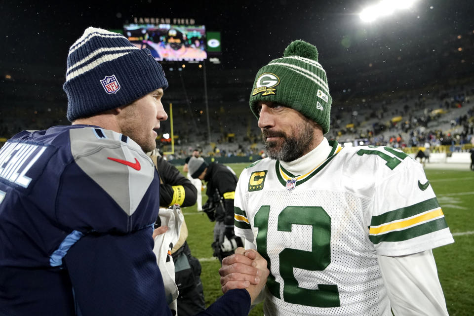 Tennessee Titans' Ryan Tannehill, left, and Green Bay Packers' Aaron Rodgers (12) greet each other after their team's NFL football game Thursday, Nov. 17, 2022, in Green Bay, Wis. (AP Photo/Morry Gash)