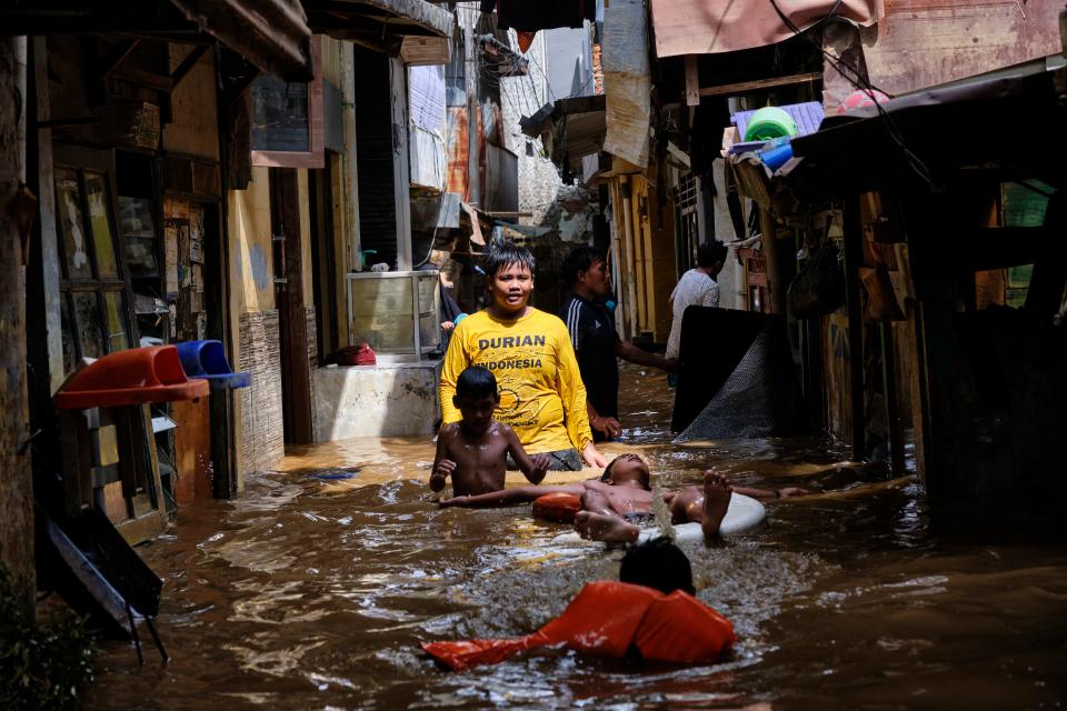 Children play in Jakarta floodwater