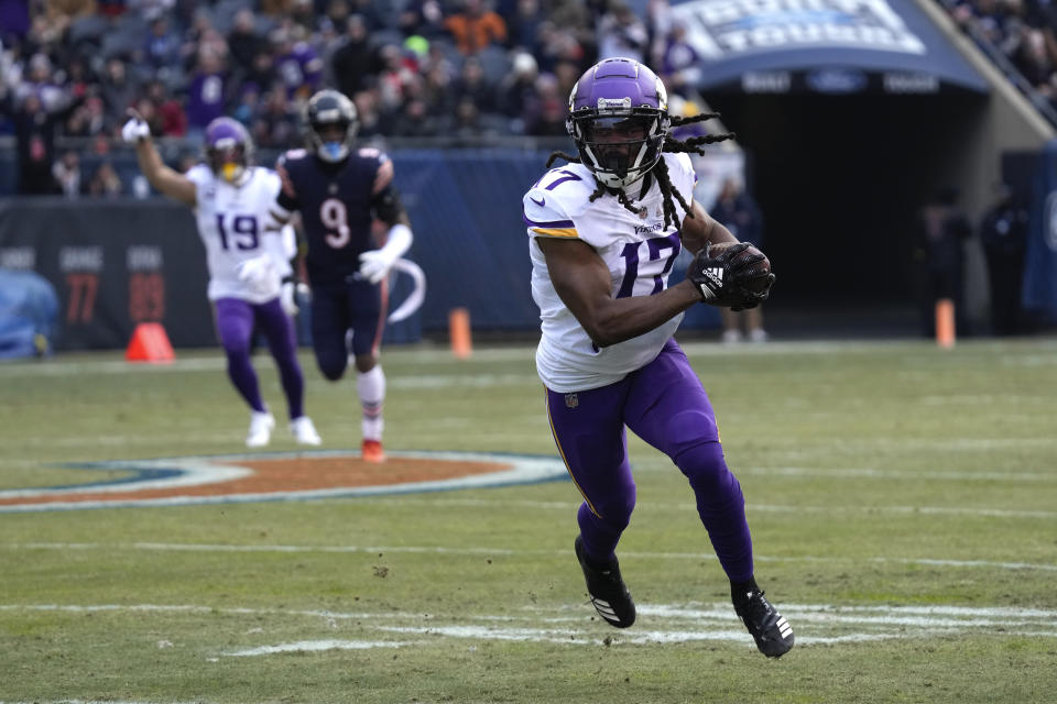 Minnesota Vikings wide receiver K.J. Osborn (17) runs up field after catching a pass during the first half of an NFL football game against the Chicago Bears, Sunday, Jan. 8, 2023, in Chicago. (AP Photo/Nam Y. Huh)