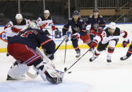 New Jersey Devils' Jonas Siegenthaler (71) moves in but is stopped by New York Rangers' Igor Shesterkin (31) during the first period of an NHL hockey game Thursday, April 15, 2021, in New York. (Bruce Bennett/Pool Photo via AP)