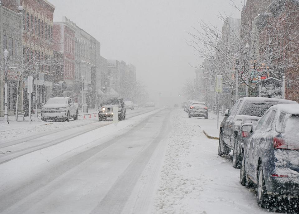 Snow falls on Jan. 12, 2024, in downtown Adrian, Michigan.