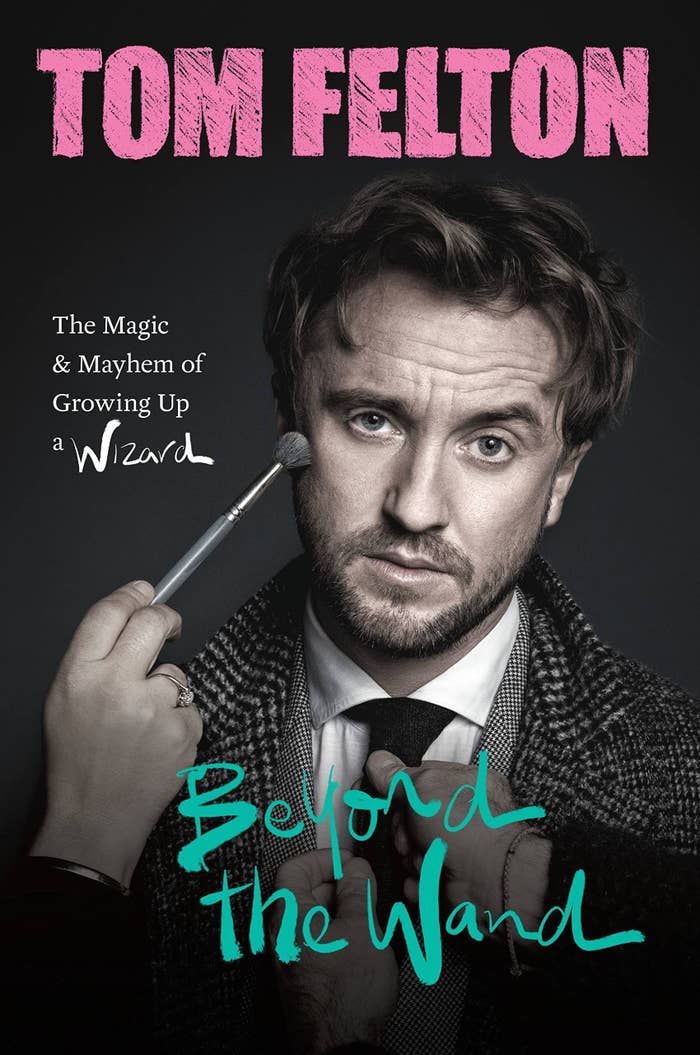 The cover of Tom's memoir which feature a hand using a brush to touch up his makeup and another set of hands adjusting his tie