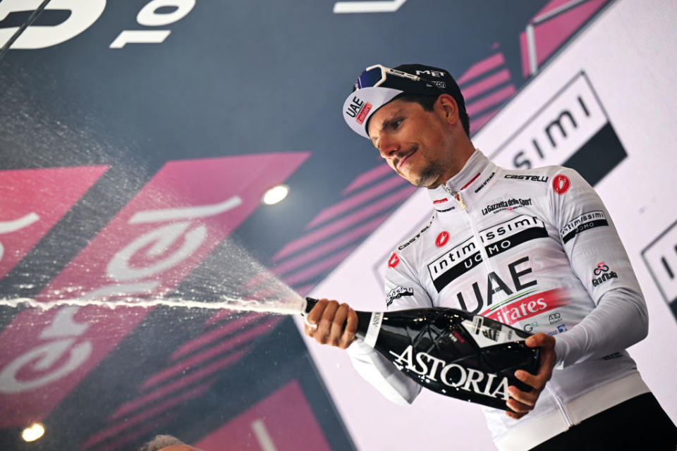 RIVOLI ITALY  MAY 18 Joao Almeida of Portugal and UAE Team Emirates celebrates at podium as White best young jersey winner during the 106th Giro dItalia 2023 Stage 12 a 185km stage from Bra to Rivoli  UCIWT  on May 18 2023 in Rivoli Italy Photo by Stuart FranklinGetty Images