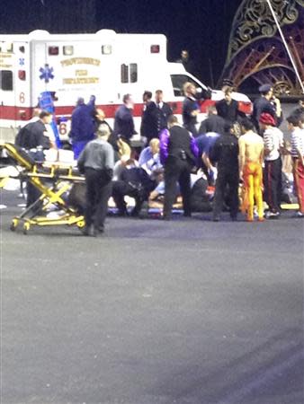 Emergency personnel attend to injured performers after a scaffolding collapsed during a Ringling Bros. and Barnum & Bailey Circus performance in Providence, Rhode Island in this picture provided by Kyle Therrien May 4, 2014. REUTERS/Handout via Kyle Therrien