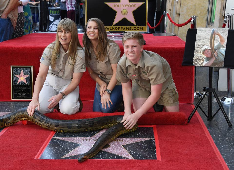 Terri Irwin, Bindi Irwin and Robert Irwin touch the newly unveiled star of Steve Irwin, who was honored posthumously with a Star on the Hollywood Walk of Fame in Hollywood, California on April 26, 2018.&nbsp;