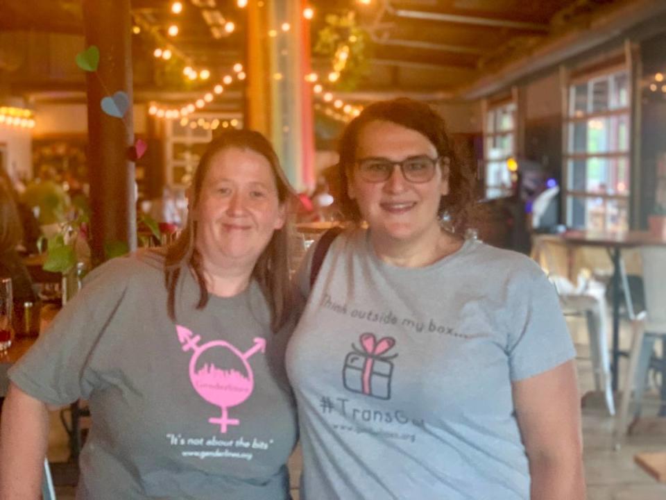Paige Dula, right, and her wife Jennifer attend a trans happy hour for Charlotte Pride Week at Resident Culture Brewing Company in Plaza Midwood. Dula said she first became interested in working at Bank of America after she learned about the company’s policies from a member of a therapy group for trans women.