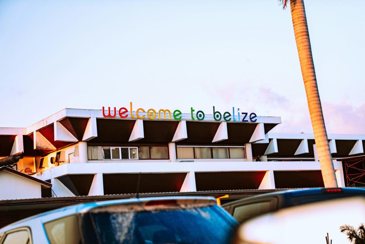 Check out this safety report on Belize and how travelers can improve their trip. pictured: the welcoming sign outside of the Belize airport