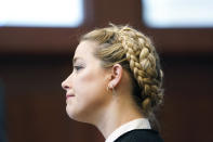 Actor Amber Heard appears in the courtroom at the Fairfax County Circuit Courthouse in Fairfax, Va., Thursday, May 19, 2022. Actor Johnny Depp sued his ex-wife Amber Heard for libel in Fairfax County Circuit Court after she wrote an op-ed piece in The Washington Post in 2018 referring to herself as a "public figure representing domestic abuse." (Shawn Thew/Pool photo via AP)